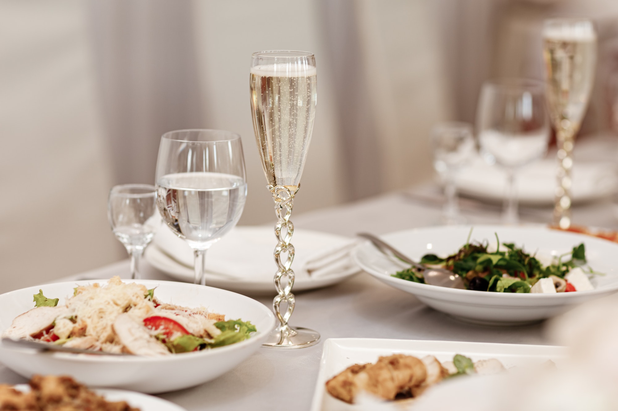 Serving table of a variety of delicious festive food and wine prepared for event party or wedding